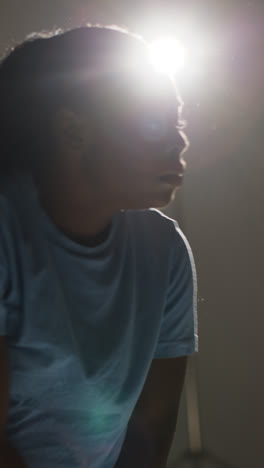 Vertical-Video-Backlit-Head-And-Shoulders-Studio-Portrait-Shot-Of-Young-Woman-Dancer-Dancing-In-Spotlight-1